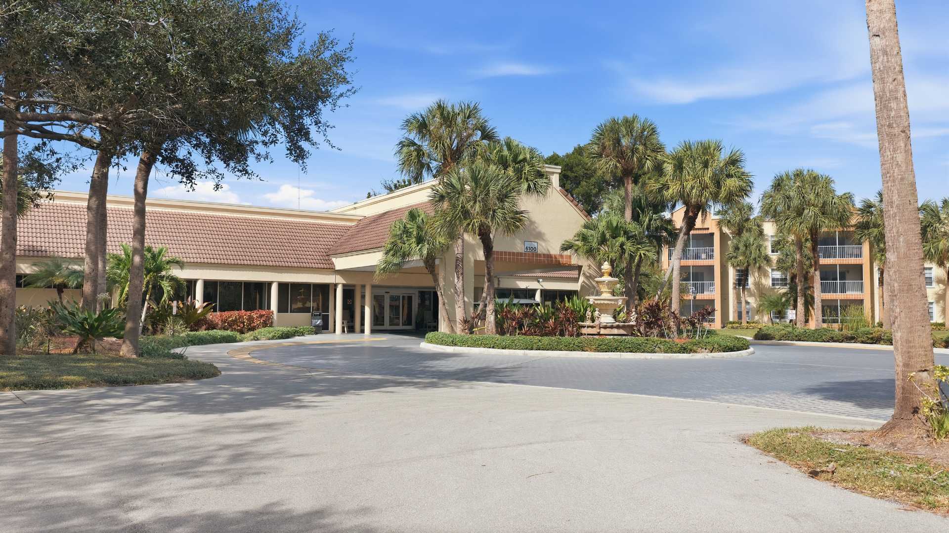 exterior entrance with covered seating and entryway
